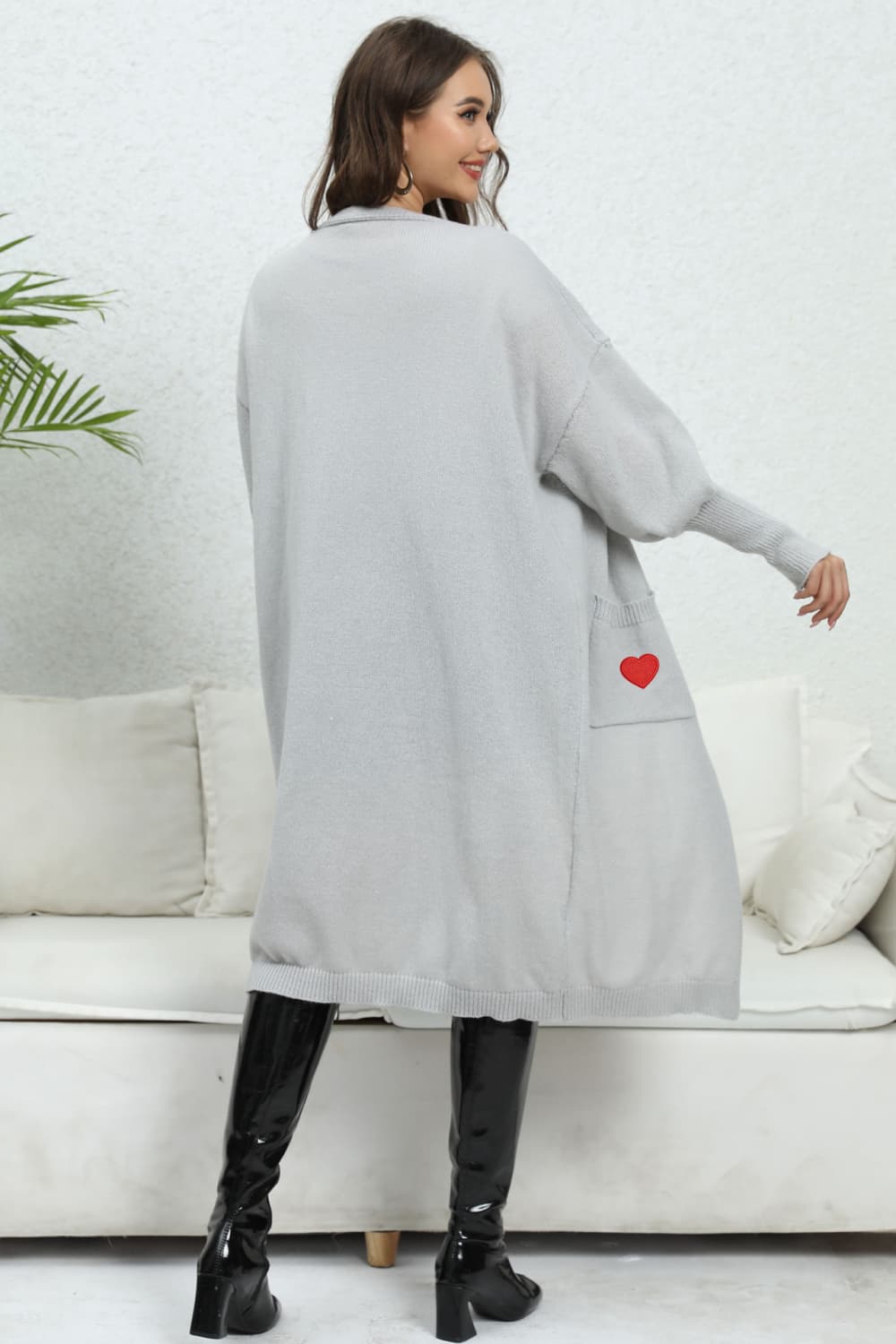 Light gray balloon sleeve cardigan with red heart pocket detail