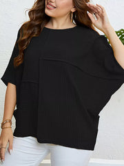 Black textured relaxed-fit t-shirt with short dolman sleeves and a crew neck.