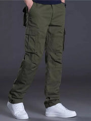 Men's green relaxed fit cargo pants with multiple pockets and cuffed ankles.
