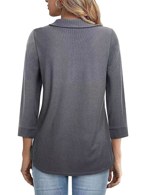 Dark gray textured polo top with 3/4 sleeves and a zip front detail.