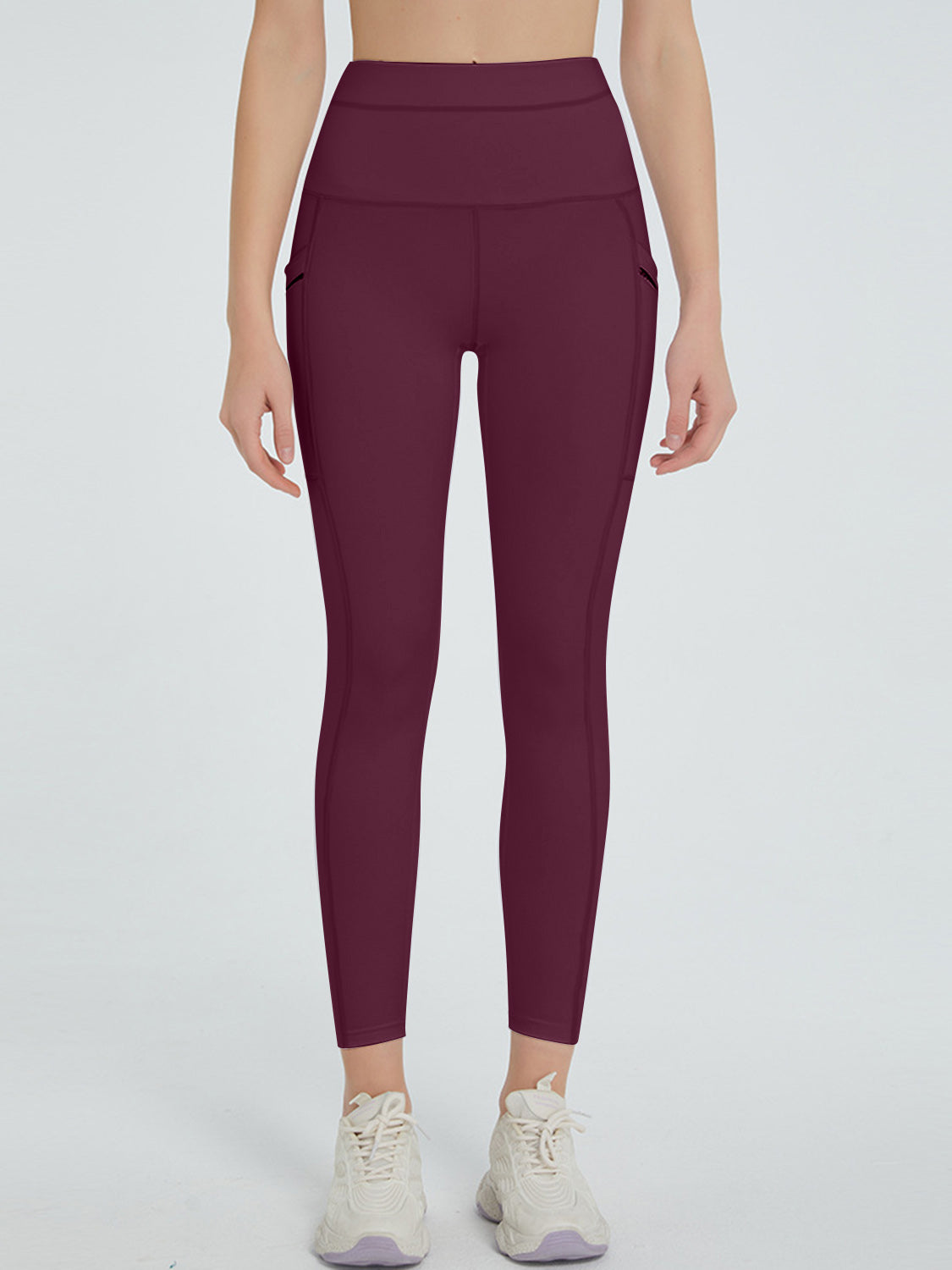 Burgundy pocketed sculpt leggings with a high waist.