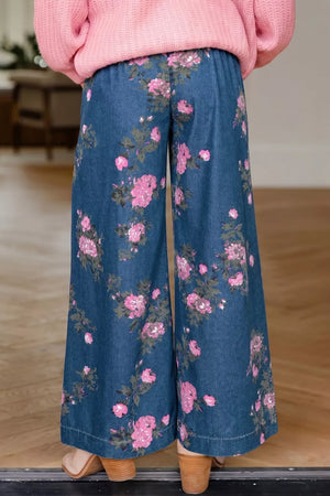 Floral print denim wide-leg jeans with a high waist.