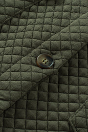 Army green quilted overshirt with button detail and patch pocket flap.