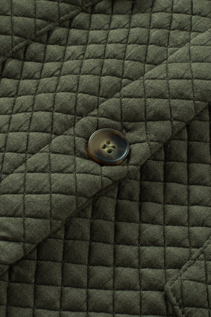 Army green quilted overshirt with button detail and patch pocket flap.