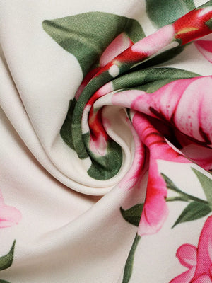 Charming Floral V-neck Midi Dress in white with pink and green floral print.