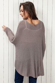 Moss asymmetric slouch knit top with a relaxed fit and curved hem.