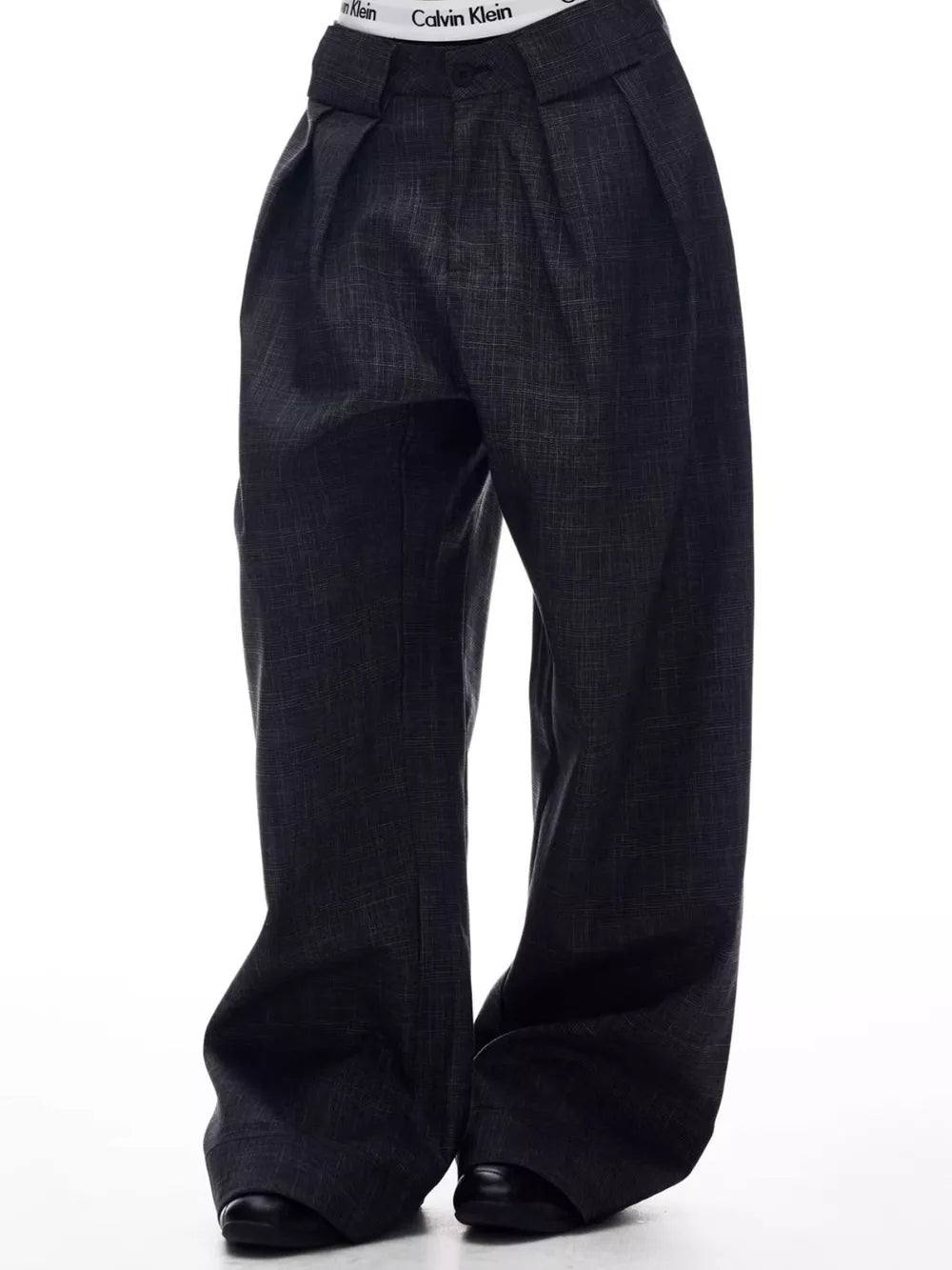 Men's dark grey wide-leg trousers with a subtle textured pattern and a comfortable, elegant fit.
