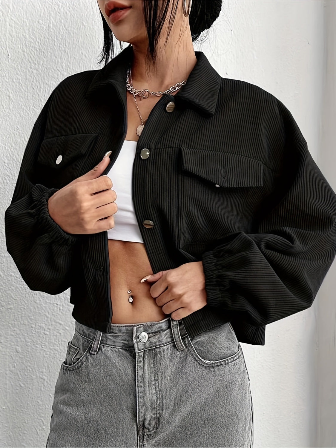 Black corduroy blouson jacket with button pockets and elastic cuffs
