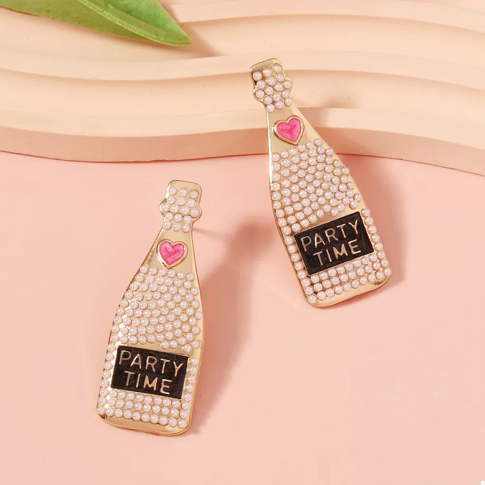 Champagne bottle drop earrings with pearls, pink heart, and PARTY TIME detail.
