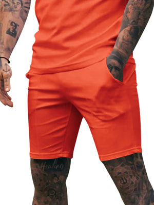 Men's orange red chino shorts with adjustable drawstring and side pockets.