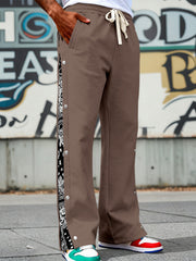 Brown sweatpants with side snaps and bandana print detail