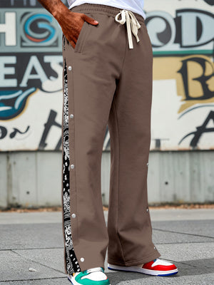 Brown sweatpants with side snaps and bandana print detail