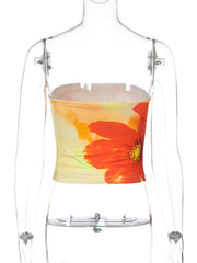 Floral print strapless tube top with abstract orange flower on yellow and orange gradient background.
