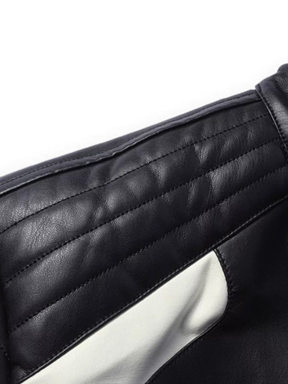 Black and white color block sport jacket with quilted shoulder detail.
