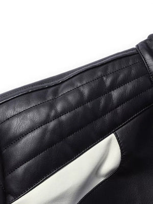 Black and white color block sport jacket with quilted shoulder detail.