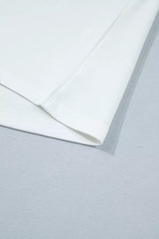 White polyester maternity t-shirt with short sleeves and a subtle hem detail.
