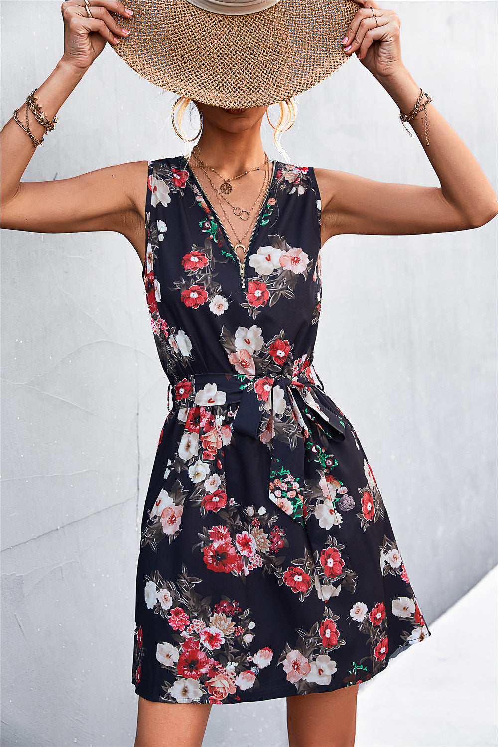Black floral zip-front mini dress with tie waist and V-neck