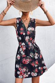 Black floral zip-front mini dress with tie waist and V-neck