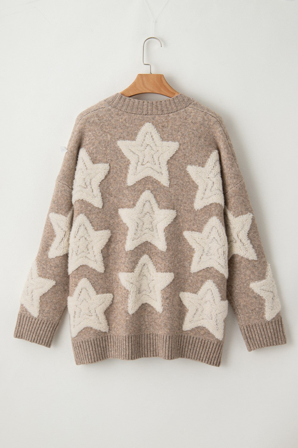 Textured starburst knit cardigan in mocha with cream stars, crew neck, long sleeves.