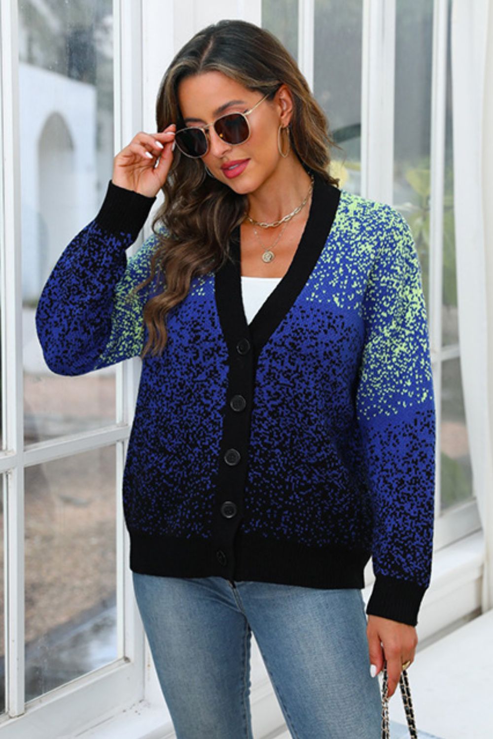 Speckled gradient knit cardigan in navy with button front and V-neck.