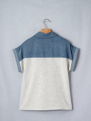 Two-tone denim polo shirt with rolled sleeves and a classic collar.