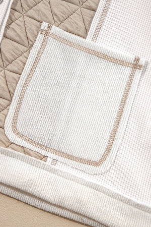 White waffle knit hoodie with quilted panel detail and contrast stitching on pocket.