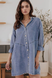 Light blue denim shirtdress with button front and ruffled cuff detail