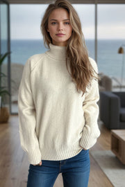 Cream speckled Donegal turtleneck sweater with ribbed cuffs and hem