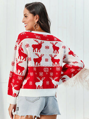 Red acrylic sweater with festive reindeer and snowflake jacquard pattern.