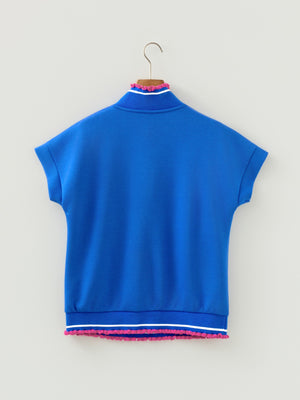 Blue polo shirt with frill collar and hem, short sleeves, and white trim