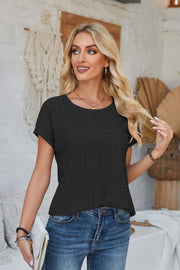 Black perforated eyelet t-shirt with cuffed short sleeves and a round neckline.