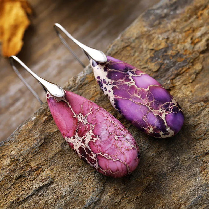 Marbled gemstone teardrop earrings in lavender and purple with silver hooks.