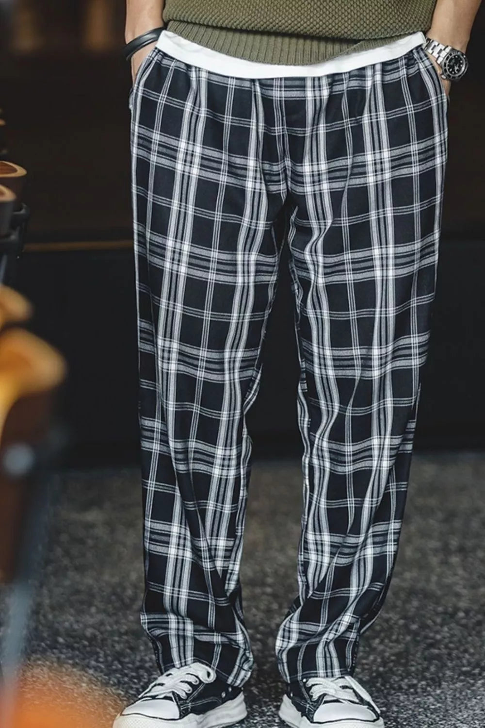 Relaxed fit black plaid men's sweatpants with a drawstring waist.