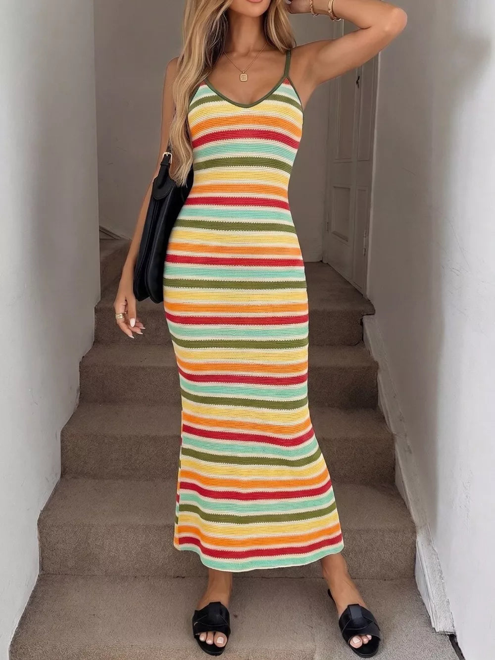 Vibrant striped bodycon midi dress with V-neck and spaghetti straps.