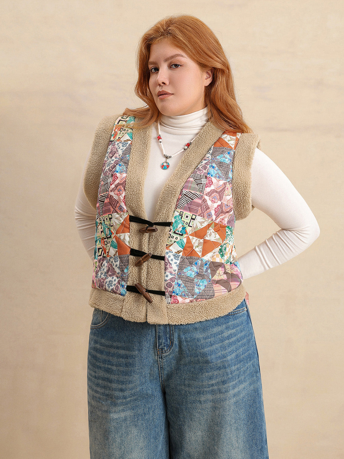 Patchwork sherpa vest with toggle closure and multicolor boho print.