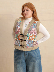Patchwork sherpa vest with toggle closure and multicolor boho print.