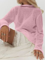 Pink sheer mock neck knit sweater with long sleeves and a relaxed fit.