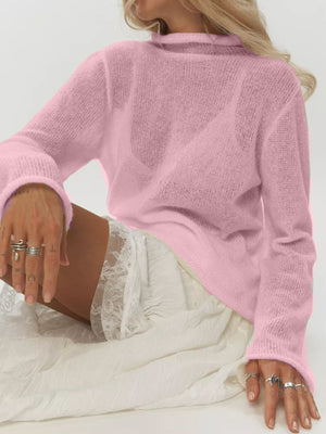 Pink sheer mock neck knit sweater with long sleeves and a relaxed fit.