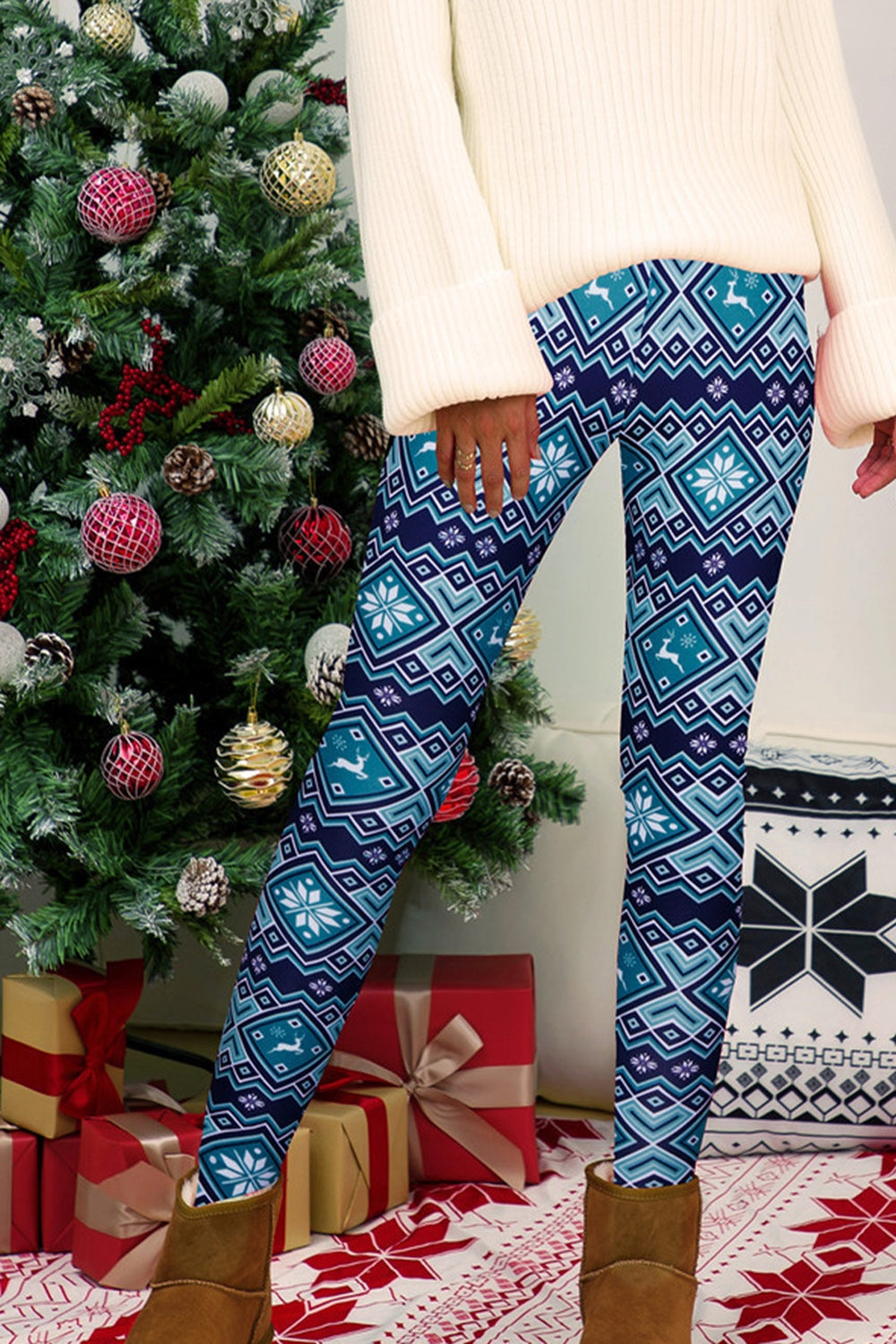 Festive Fair Isle leggings in cerulean blue with snowflake and reindeer pattern.