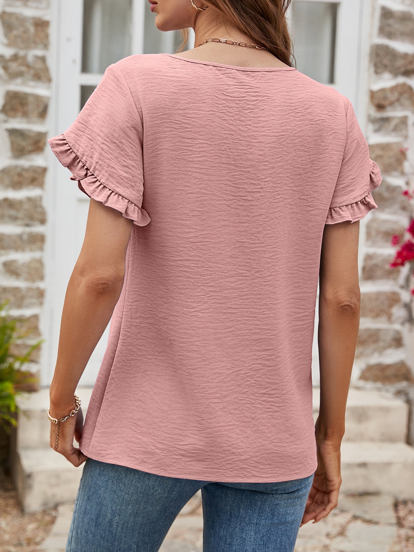 Dusty Pink t-shirt with textured fabric and ruffled cap sleeves.