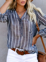V-neck striped buttoned blouse in dusty blue with a chest pocket and buttoned cuffs.