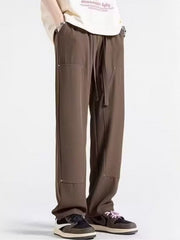 Men's brown relaxed fit drawstring sweatpants with pockets and stitched details.