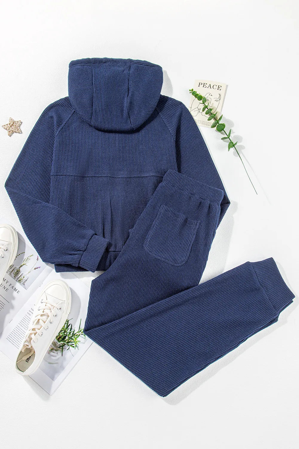 Navy ribbed crop hoodie and jogger set with pockets.
