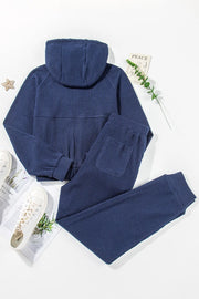 Navy ribbed crop hoodie and jogger set with pockets.