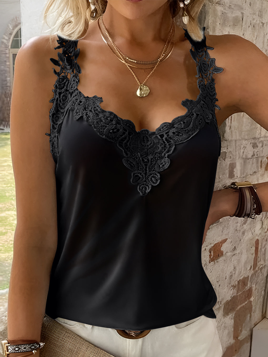 Black lace trimmed halter cami with a V-neckline.