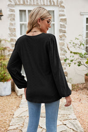 Black eyelet yoke blouson sleeve top with textured pattern