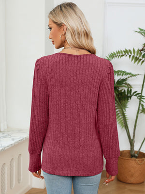 Ribbed knit sweater in Brick Red with crochet trim detail and puff sleeves.