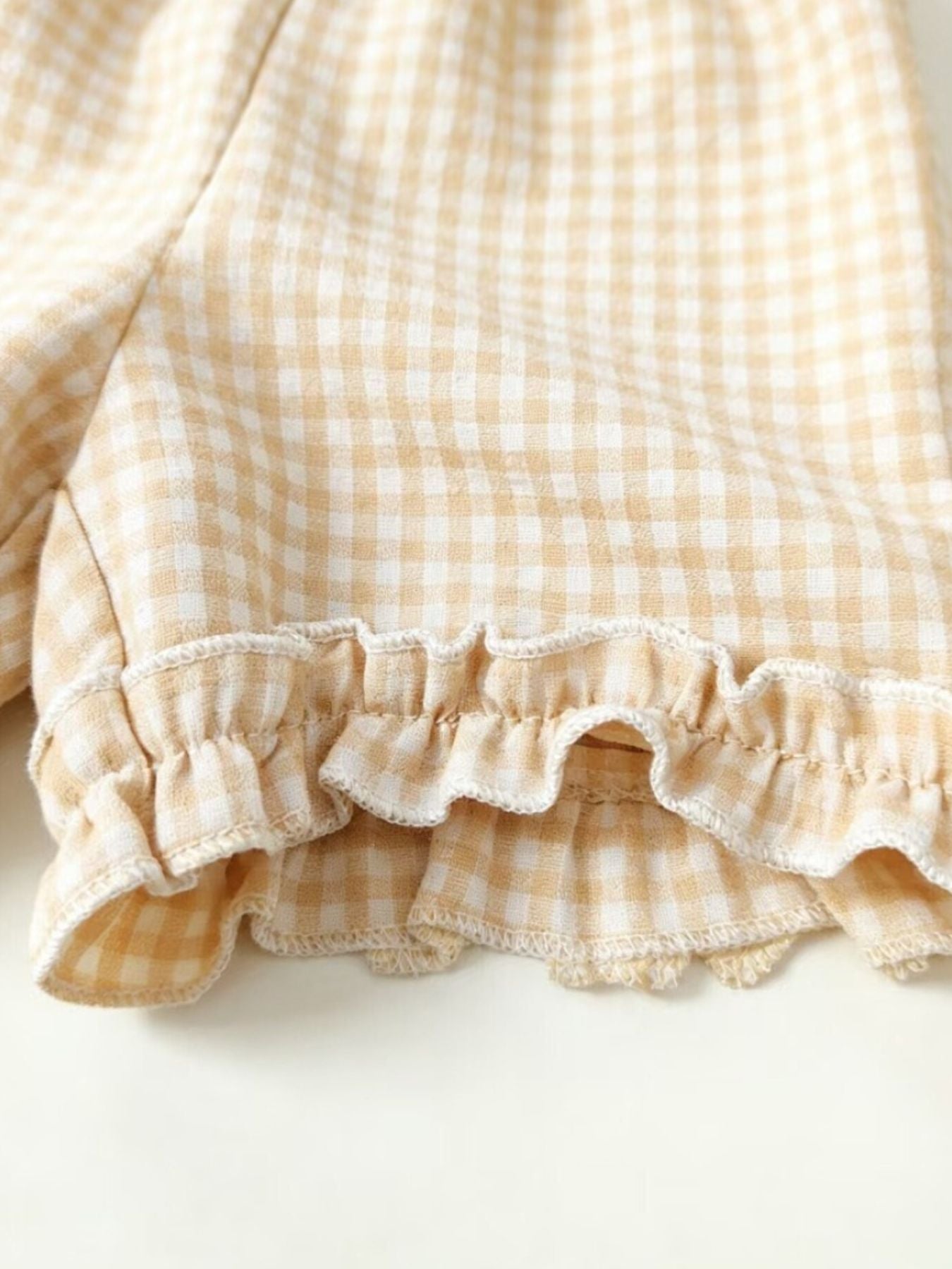 Children's beige gingham cotton set with ruffled hem detail