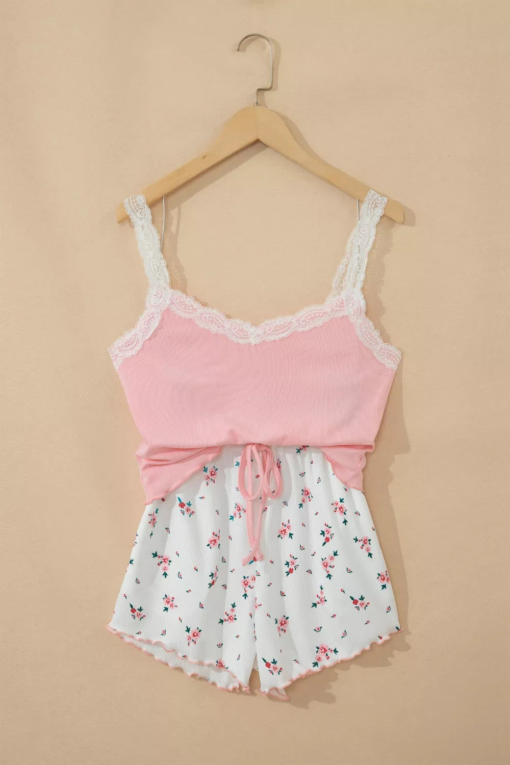 Pink lace-trimmed cami pajama set with white floral print drawstring shorts