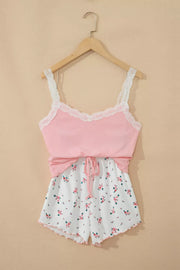 Pink lace-trimmed cami pajama set with white floral print drawstring shorts